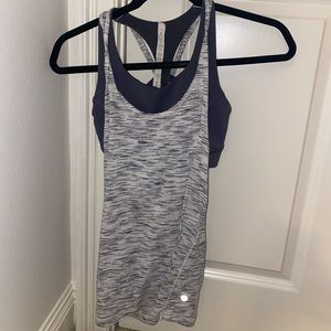 Super cute size 4 Lululemon workout shirt with a two in one top and bra!
